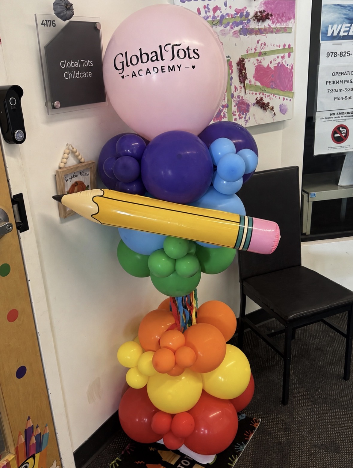 Colorful pencil balloon sculpture installed at a school